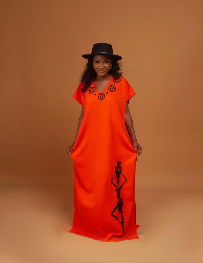 A vibrant loose-fit dress with V-neckline and side-cut details.